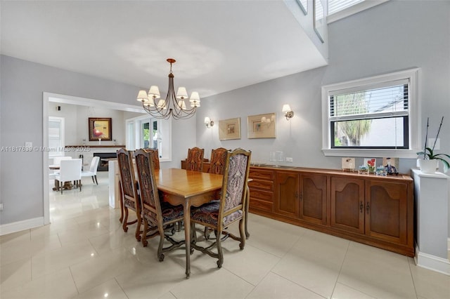 11537 SW 34th Ln, Miami, FL 33165 - dining room with a chandelier, light tile patterned flooring, and baseboards