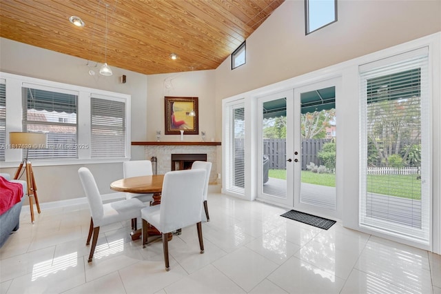 11537 SW 34th Ln, Miami, FL 33165 - dining space with wooden ceiling, light tile patterned floors, french doors, high vaulted ceiling, and baseboards