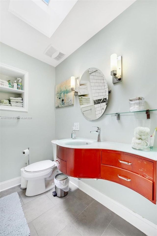 11537 SW 34th Ln, Miami, FL 33165 - bathroom with vanity, toilet, tile patterned flooring, and a skylight