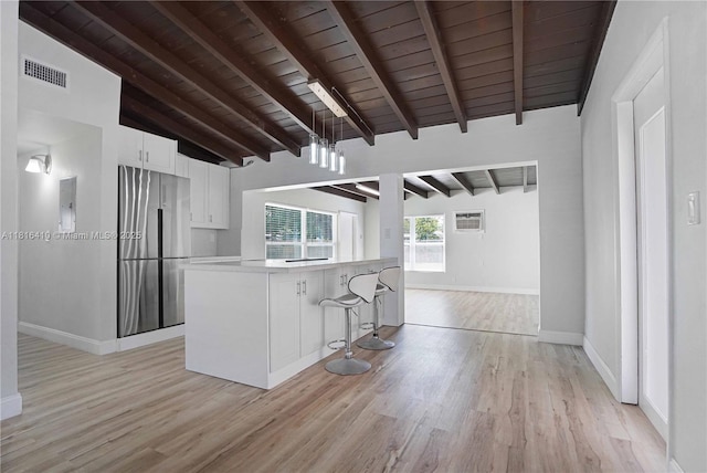 1025 SW 22nd Ter, Fort Lauderdale, FL 33312 - kitchen featuring stainless steel fridge, wood ceiling, light wood-style floors, white cabinetry, and light countertops
