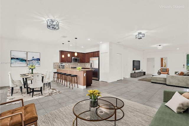 279 SE 31st Ter, Homestead, FL 33033 - living area with light tile patterned floors and recessed lighting