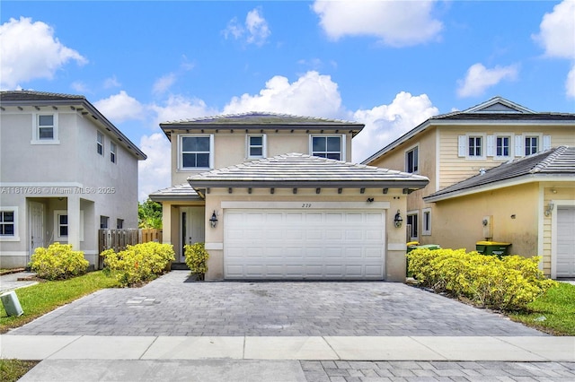 279 SE 31st Ter, Homestead, FL 33033 - view of front of property featuring decorative driveway, stucco siding, an attached garage, and a tile roof