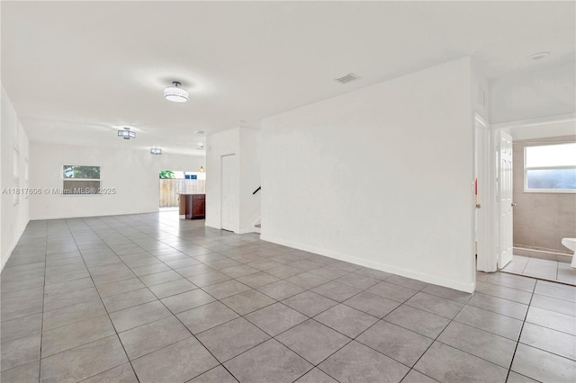 279 SE 31st Ter, Homestead, FL 33033 - unfurnished room featuring tile patterned floors and stairway