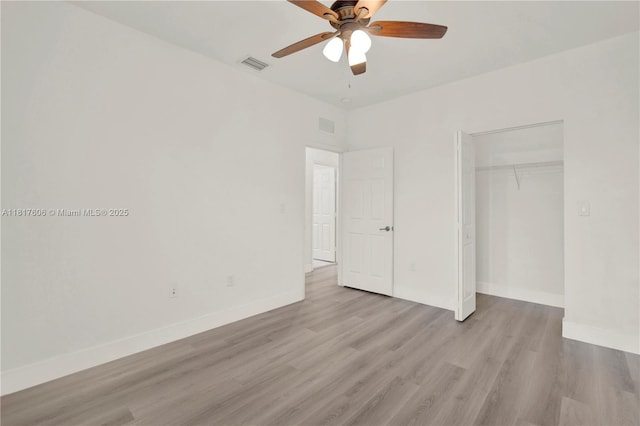 279 SE 31st Ter, Homestead, FL 33033 - unfurnished bedroom featuring a closet, light wood-style floors, and a ceiling fan