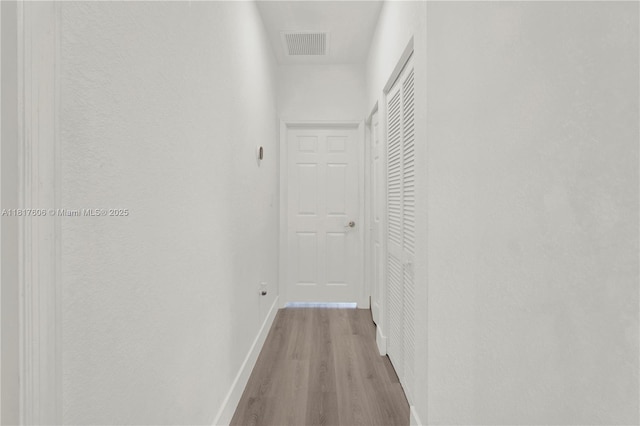 279 SE 31st Ter, Homestead, FL 33033 - corridor with light wood finished floors and baseboards