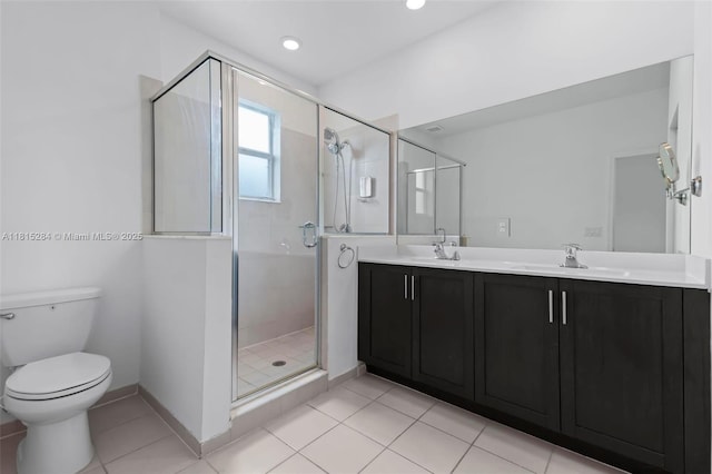 2652 SE 13th St, Homestead, FL 33035 - bathroom featuring double vanity, a shower stall, toilet, tile patterned flooring, and recessed lighting