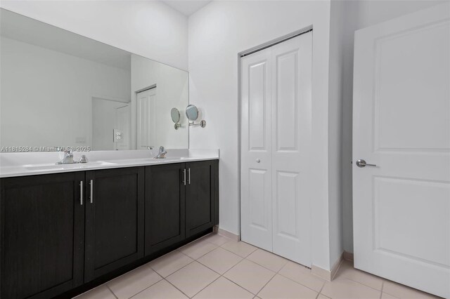 2652 SE 13th St, Homestead, FL 33035 - full bathroom with double vanity, a closet, tile patterned floors, and baseboards