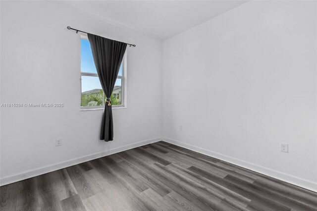 2652 SE 13th St, Homestead, FL 33035 - unfurnished room featuring dark wood finished floors and baseboards