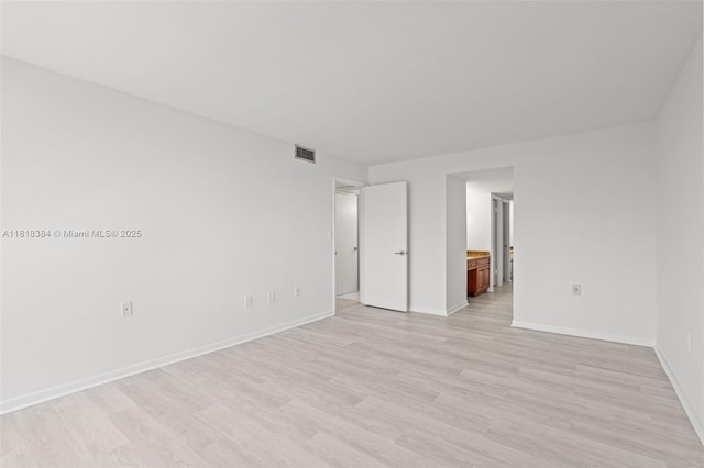 1450 Brickell Bay Dr Unit 806, Miami, FL 33131 - empty room with light wood-type flooring and baseboards