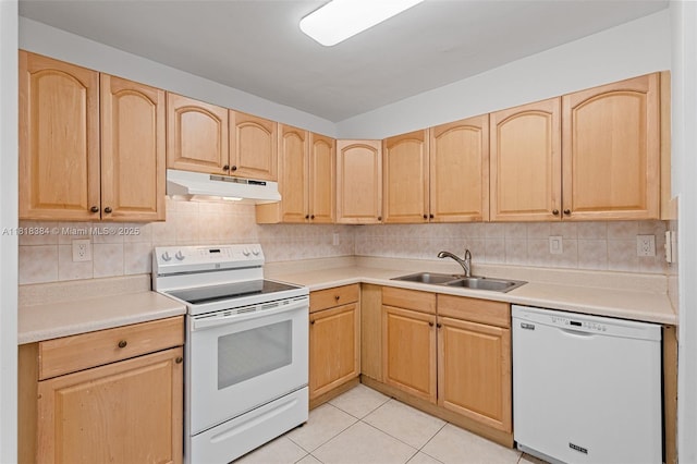 1450 Brickell Bay Dr Unit 806, Miami, FL 33131 - kitchen featuring white appliances, under cabinet range hood, light brown cabinetry, and a sink