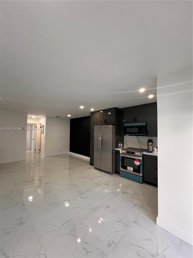 1818 Rodman St Unit 2D, Hollywood, FL 33020 - kitchen with stainless steel appliances, baseboards, light marble finish floors, light countertops, and recessed lighting
