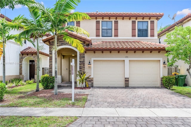 150 NE 23rd Ter, Homestead, FL 33033 - view of front of house featuring stucco siding, decorative driveway, and an attached garage