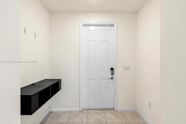 150 NE 23rd Ter, Homestead, FL 33033 - entryway featuring baseboards and light tile patterned floors
