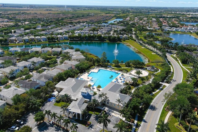150 NE 23rd Ter, Homestead, FL 33033 - aerial view of property and surrounding area featuring a nearby body of water, a pool, and nearby suburban area