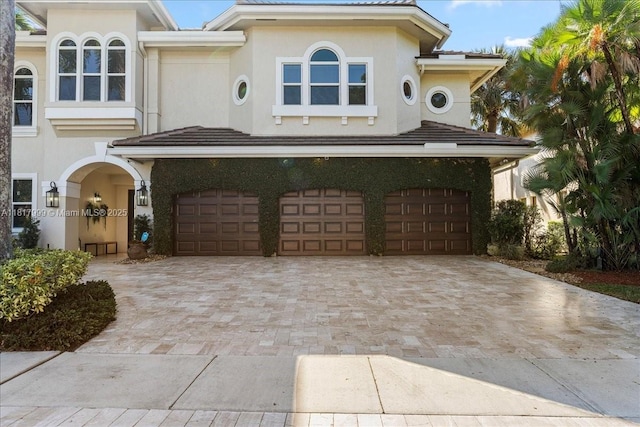 3212 NW 64th St, Boca Raton, FL 33496 - view of front of home featuring an attached garage, driveway, and stucco siding