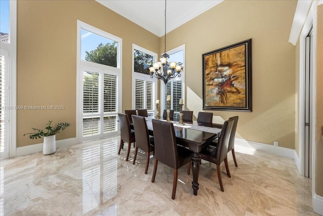 3212 NW 64th St, Boca Raton, FL 33496 - dining area featuring a chandelier, crown molding, light marble finish floors, baseboards, and a towering ceiling