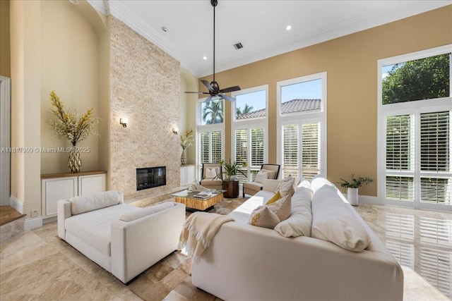 3212 NW 64th St, Boca Raton, FL 33496 - living area featuring a towering ceiling, crown molding, a high end fireplace, baseboards, and ceiling fan