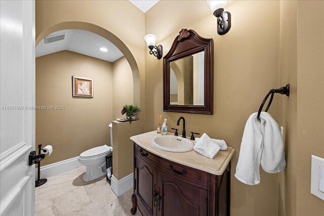 3212 NW 64th St, Boca Raton, FL 33496 - half bath featuring toilet, vanity, baseboards, and recessed lighting