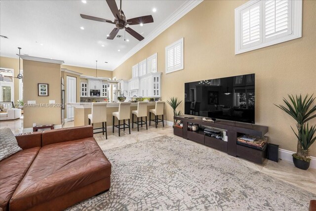3212 NW 64th St, Boca Raton, FL 33496 - living room featuring ornamental molding, ceiling fan, baseboards, recessed lighting, and a towering ceiling