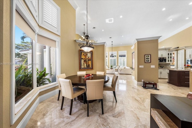 3212 NW 64th St, Boca Raton, FL 33496 - dining space featuring light marble finish flooring, crown molding, recessed lighting, and baseboards