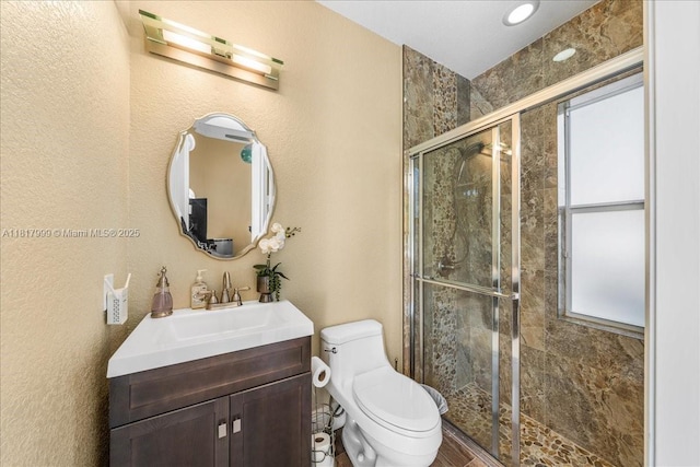 3212 NW 64th St, Boca Raton, FL 33496 - bathroom with vanity, a stall shower, toilet, a textured wall, and healthy amount of natural light