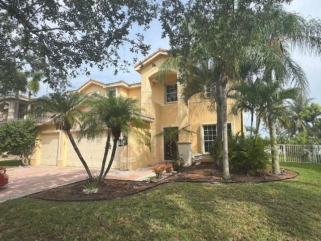15341 SW 20th St, Miramar, FL 33027 - mediterranean / spanish-style home with stucco siding, decorative driveway, and a tiled roof