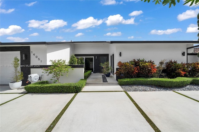 14051 SW 48th St, Miami, FL 33175 - contemporary house featuring stucco siding and a garage