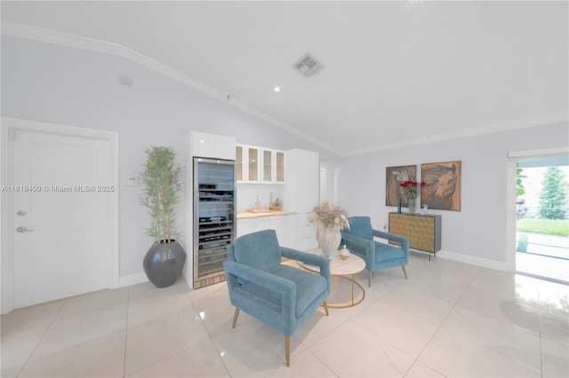 14051 SW 48th St, Miami, FL 33175 - living area with vaulted ceiling, beverage cooler, crown molding, light tile patterned floors, and baseboards