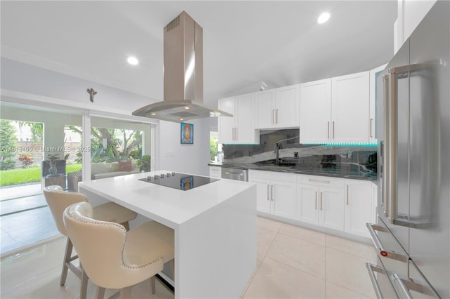 14051 SW 48th St, Miami, FL 33175 - kitchen featuring high quality fridge, island range hood, black electric cooktop, a sink, and a center island