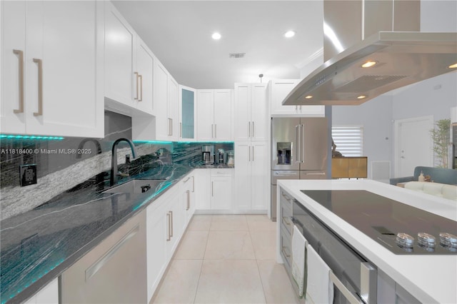 14051 SW 48th St, Miami, FL 33175 - kitchen featuring a sink, ventilation hood, stainless steel appliances, tasteful backsplash, and white cabinetry