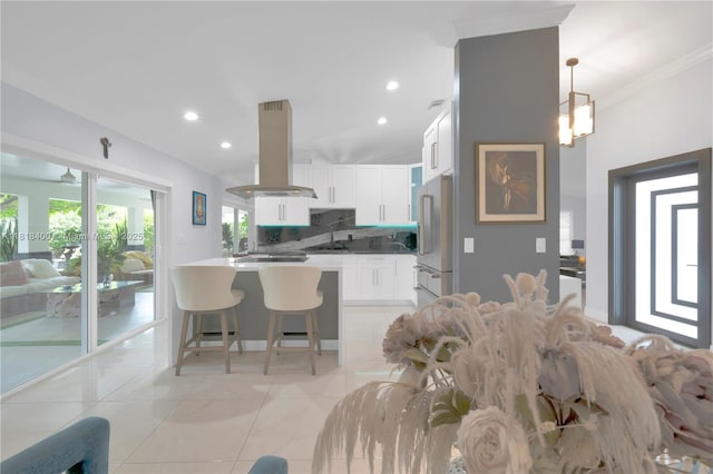 14051 SW 48th St, Miami, FL 33175 - living room with light tile patterned flooring, recessed lighting, and crown molding