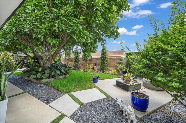 14051 SW 48th St, Miami, FL 33175 - fenced backyard with a patio area