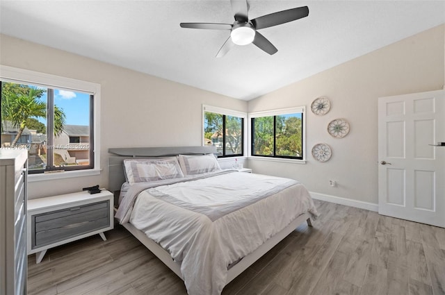 9916 SW 218th Ter, Cutler Bay, FL 33190 - bedroom featuring light wood-style floors, lofted ceiling, baseboards, and a ceiling fan