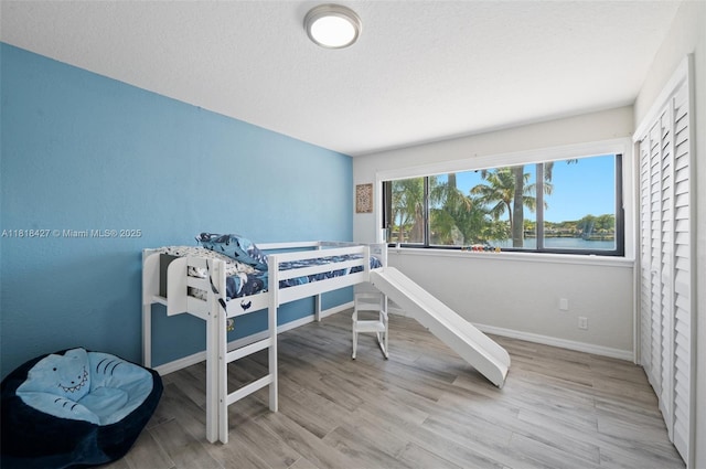 9916 SW 218th Ter, Cutler Bay, FL 33190 - bedroom with baseboards and wood finished floors