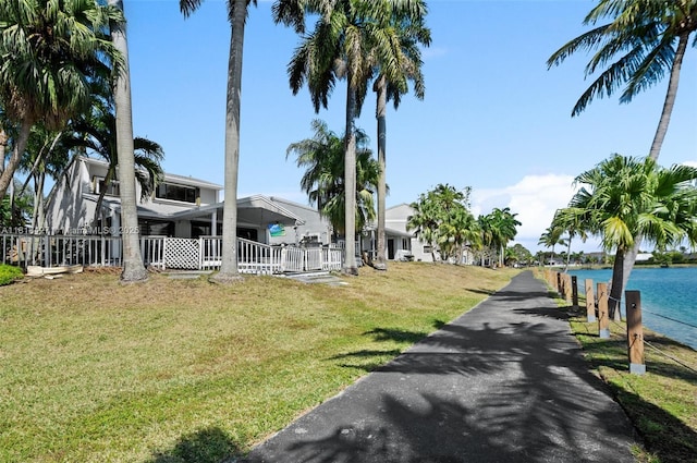 9916 SW 218th Ter, Cutler Bay, FL 33190 - view of home's community with a lawn and a water view
