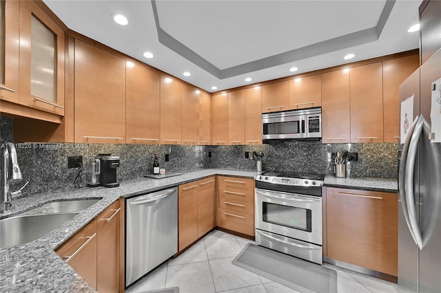 2100 S Ocean Ln Unit 703, Fort Lauderdale, FL 33316 - kitchen with appliances with stainless steel finishes, recessed lighting, stone counters, backsplash, and light tile patterned floors