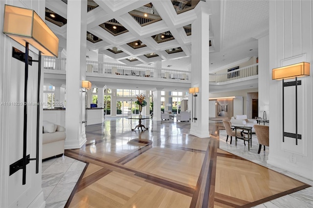 2100 S Ocean Ln Unit 703, Fort Lauderdale, FL 33316 - common area featuring a high ceiling, coffered ceiling, and beam ceiling