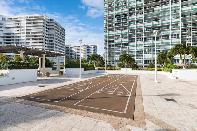 2100 S Ocean Ln Unit 703, Fort Lauderdale, FL 33316 - surrounding community with a pergola, shuffleboard, and a view of city