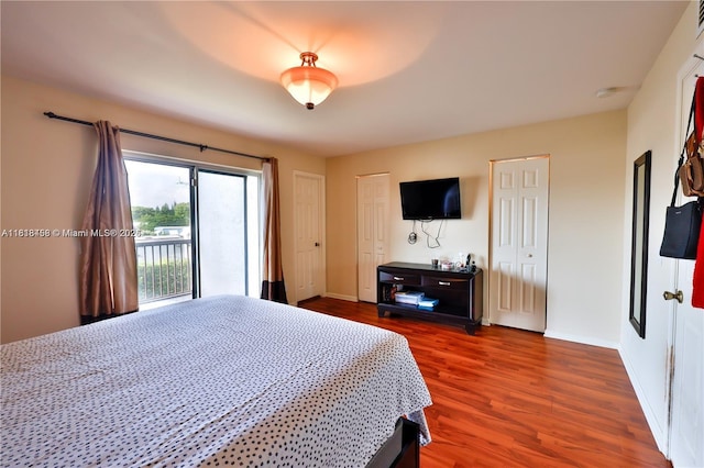 1325 Partridge Close, Pompano Beach, FL 33064 - bedroom with access to exterior, wood finished floors, and two closets