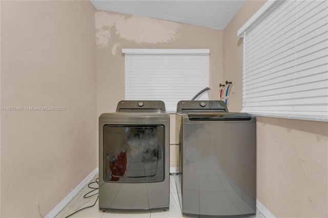 1478 NW 74th St, Miami, FL 33147 - washroom featuring washer and clothes dryer and tile patterned flooring