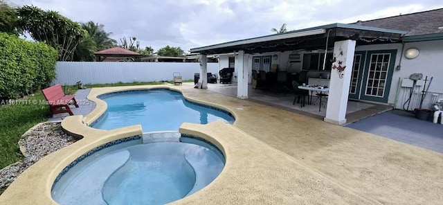 7115 SW 147th Ct, Miami, FL 33193 - view of pool with a patio area, a fenced backyard, outdoor dining area, and a pool with connected hot tub