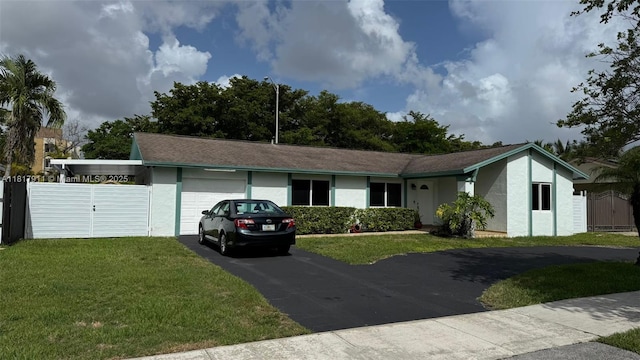 7115 SW 147th Ct, Miami, FL 33193 - ranch-style home with driveway, a garage, a front lawn, and stucco siding