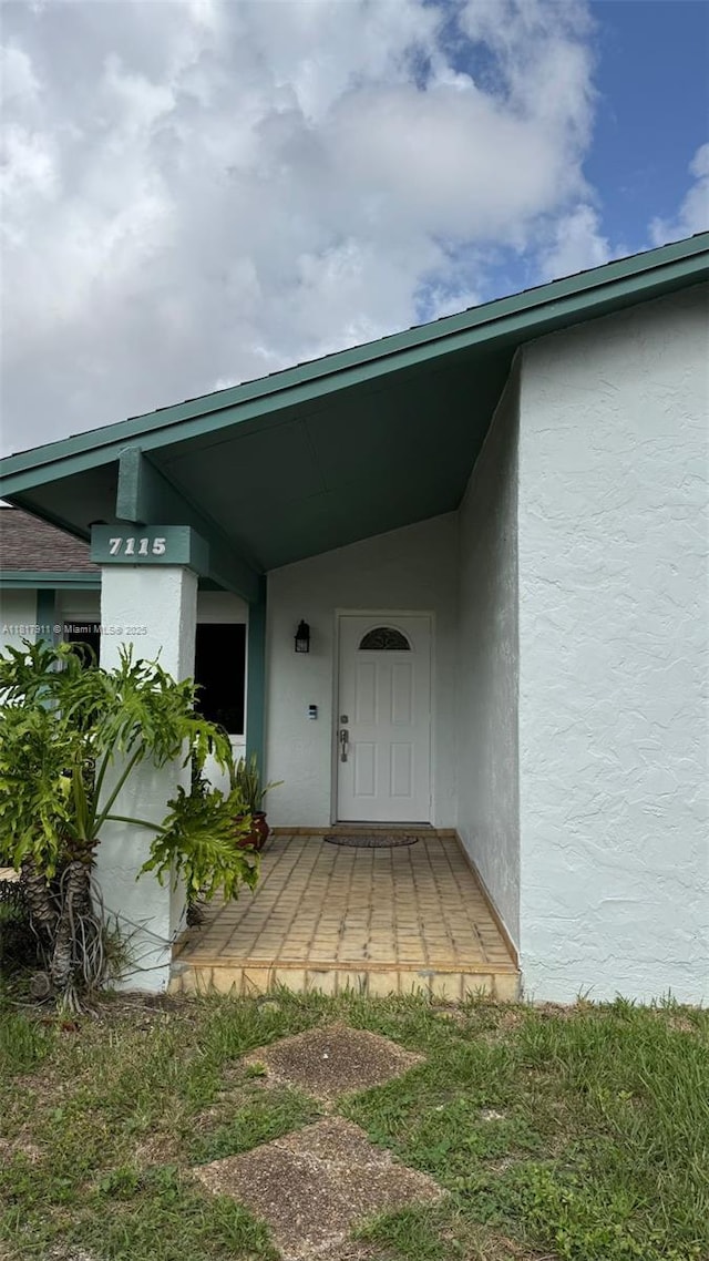 7115 SW 147th Ct, Miami, FL 33193 - property entrance featuring stucco siding