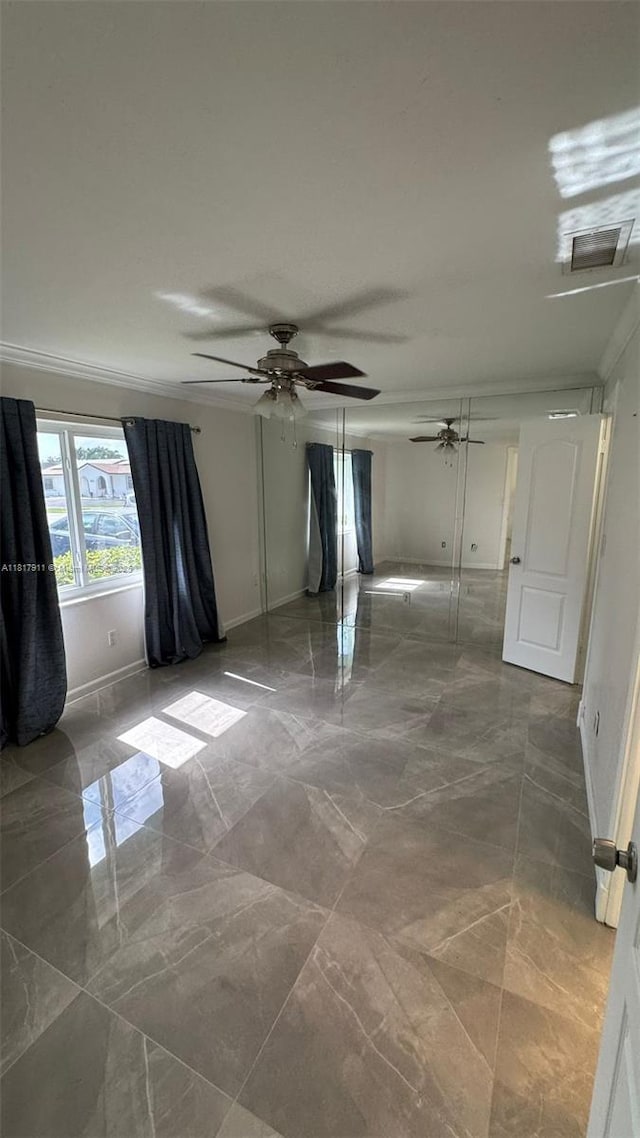 7115 SW 147th Ct, Miami, FL 33193 - spare room featuring marble tiled flooring, crown molding, and ceiling fan