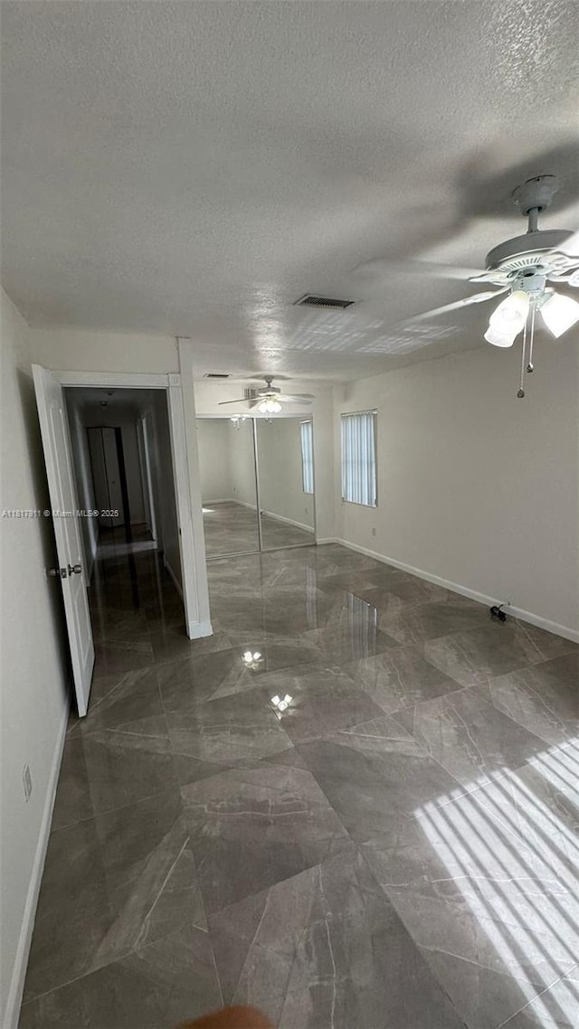 7115 SW 147th Ct, Miami, FL 33193 - spare room with a ceiling fan, a textured ceiling, and marble finish floors