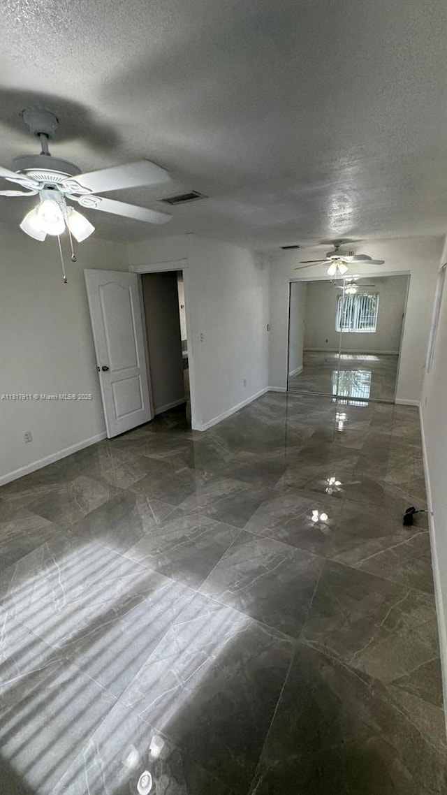7115 SW 147th Ct, Miami, FL 33193 - unfurnished room with ceiling fan and a textured ceiling