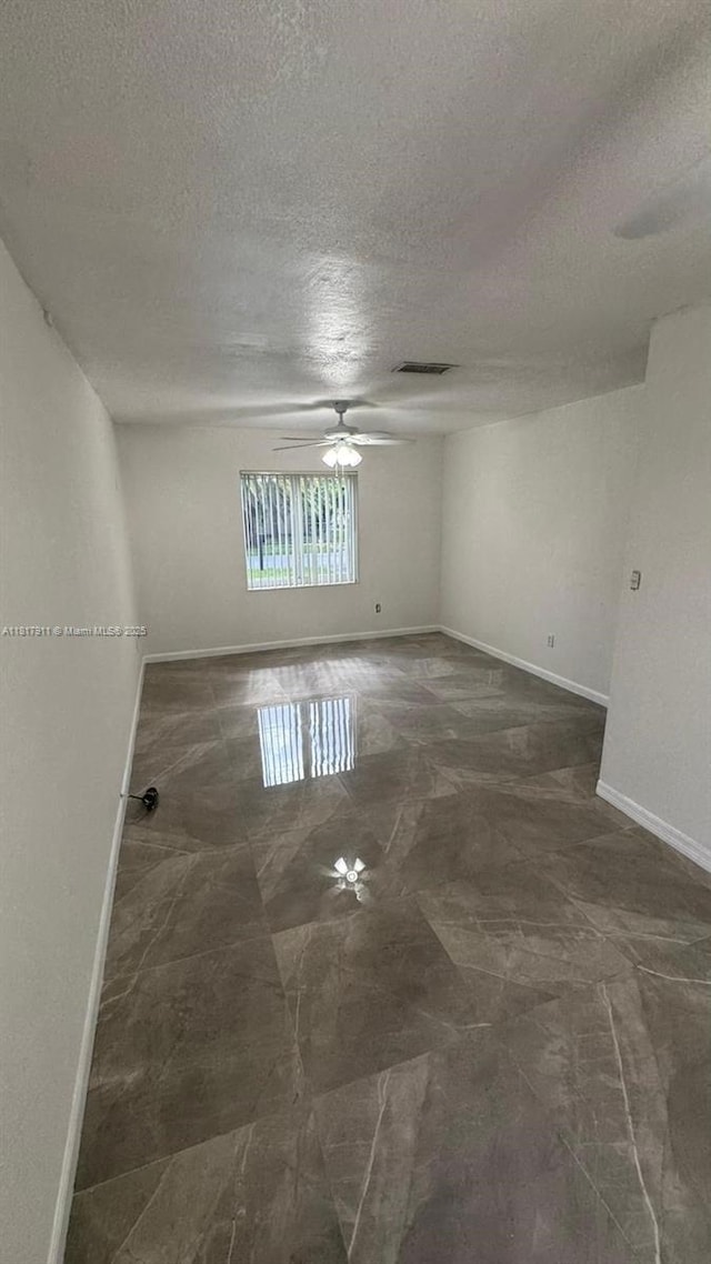 7115 SW 147th Ct, Miami, FL 33193 - empty room featuring a textured ceiling and ceiling fan