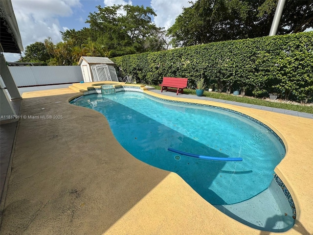 7115 SW 147th Ct, Miami, FL 33193 - view of swimming pool with a shed, a fenced backyard, a patio area, and a pool with connected hot tub