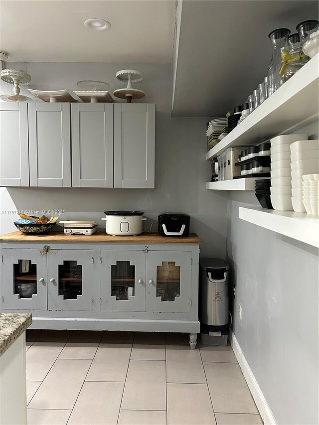 2320 SW 16th Ter, Miami, FL 33145 - kitchen featuring light tile patterned floors, open shelves, and recessed lighting