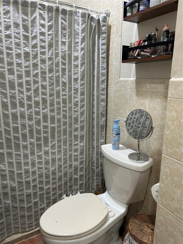2320 SW 16th Ter, Miami, FL 33145 - bathroom with tile walls and a shower with curtain